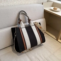 Canvas and leather tote bag in black and brown with a geometric patterned shoulder strap - Small Black