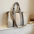 Large beige canvas tote bag with grey leather handles and vintage patterned strap - Large Size Brown