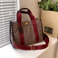 Brown canvas tote bag with red striped handles and golden twist lock closure - Small / Brown