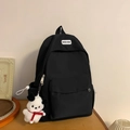Zaino minimalista in nylon nero con ciondolo a cucciolo e tasca frontale esterna - Nero Con Pendente
