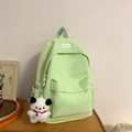 Minimalist mint green student backpack with white puppy charm and BOKA BAG label - Green with Charm