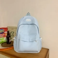 Minimalist light blue backpack for women with front zipper pocket and BOKA BAG logo - Blue Without Charm
