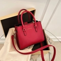 Elegant red leather wedding handbag with luxury lychee texture and gold hardware details - Burgundy