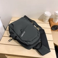 Dark grey large capacity crossbody chest bag with adjustable strap on wooden table - Standard Type / Gray