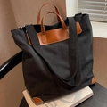 Bolso tote de lona negra con asas de cuero marrón y correa de hombro ancha - Negro