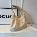 Beige canvas tote bag with colorful letter embroidery and leather logo detail - Off White