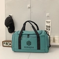 Teal nylon travel duffel bag with black handles and spacious multi-pocket design - Green