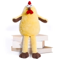 Simpatico pollo di peluche giallo con gambe lunghe e cresta rossa seduto su libri - Bambola Pulcino Gambe Lunghe / Giallo