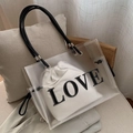 Transparent PVC tote bag with white inner pouch and LOVE print on the surface - White