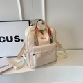 Mochila beige elegante con correas de estilo bohemio y bordado floral distintivo - Blanco Roto