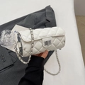 Chic white quilted cylinder bag with silver metal twist lock and chain strap detail - White