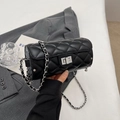 Chic black cylinder bag with quilted pattern, silver chain strap and metal clasp lock - Black