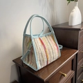 Colorful striped woven handbag with light blue handles and adjustable shoulder strap - Blue