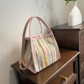 Colorful striped woven tote bag with pink leather handles and matching shoulder strap - Pink