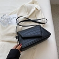 Chic black crocodile embossed flap crossbody bag with elegant gold metal hardware details - Black
