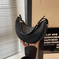 Minimalist black crescent hobo bag with pleated leather texture and gold hardware - Black