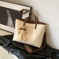 Cream and brown contrast tote bag with a knitted bear charm and woven shoulder strap - With Pendant / White