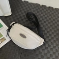 Minimalist off-white sporty chest bag with black adjustable strap and brand patch - White