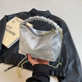 Silver pleated handbag with a metallic finish and gold chain strap for versatile styling - Silver