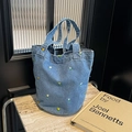 Blue denim bucket tote bag featuring colorful tulip embroidery and sturdy dual handles - Light Blue