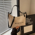 Borsa a tracolla in tela beige con finiture in pelle nera e stampa RESTAIN GVERY - Bianco Sporco
