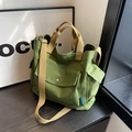 Olive green canvas tote bag with multi-pocket utility design and khaki strap - Green
