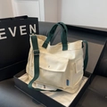 Retro cream canvas tote bag with dark green straps and functional front flap pocket - White