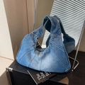Vintage patchwork denim underarm bag with washed blue fabric and metal zipper detail - Light Blue