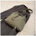 Detail of grey-green nylon drawstring tote bag with water-resistant pleated texture - No Pendant / Green