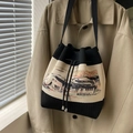Knitted bucket bag with landscape art print and wide black strap on beige trench coat - Oriental Landscape Architecture Style (Style 1)