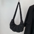 Minimalist black quilted dumpling bag with cloud-like pleats and wide shoulder strap - Black Large