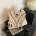 Beige drawstring tote bag with plush coffee cup charm and wide adjustable shoulder strap - With Pendant / Khaki
