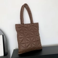 Quilted down tote bag in dark brown with geometric triangle stitching and top handles - Brown