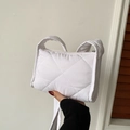 White quilted shoulder bag with diamond stitching and soft padded strap design - White