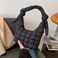 Chic black quilted puffy hobo bag with a stylish knotted shoulder strap detail - Black