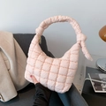 Pink quilted puffer crossbody bag with soft knotted handle and golden zipper detail - Pink