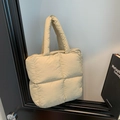 Quilted down cotton tote bag in cream finish featuring a puffer texture and top handles - Khaki