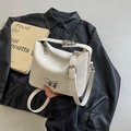 Chic white bucket bag with cracked leather texture and silver butterfly accessory - Off White