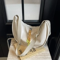 Off-white half-moon hobo bag with wide fabric strap and yellow zipper detail - Off-white