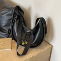 Black hobo shoulder bag in matte leather featuring a woven zipper pull with yellow accents - Black