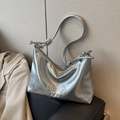 Chic silver metallic pleated shoulder bag with embossed letters and sleek knotted strap - Silver