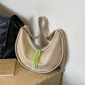 Beige large crescent hobo bag with neon green zip puller on stone pedestal - Khaki