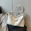 Minimalist white soft leather shoulder bag with embossed text and rope knot strap - White