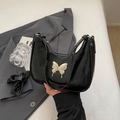 Elegante borsa a mano in pelle verniciata nera a mezzaluna con fibbia a farfalla argentata - Nero Piccolo