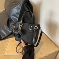 Small black leather bucket bag with butterfly embossing and cute dog bag charm - With Puppy Pendant / Black