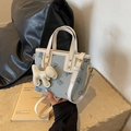 Light blue bucket bag with navy butterfly print, featuring a white dog charm and strap - With Puppy Pendant / Blue