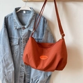 Fashionable orange pleated tote bag in crescent shape with iFashion label and strap - No Pendant / Orange