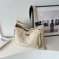 Minimalistische beige Canvas-Umhängetasche mit Doppelreißverschluss und verstellbarem Gurt - Gebrochenes Weiß