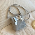 Silver metallic bucket bag with large bow and crossbody strap on waffle cushion - Silver
