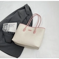 Close-up of beige tote bag with pink straps and 3D cartoon embossed details - Pink No Pendant